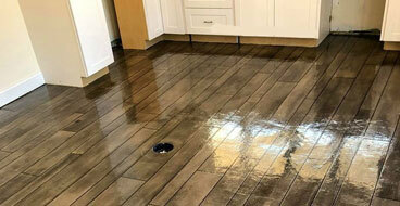 Economical Solution This image shows a floor that has a wood Stamped Concrete Flooring.