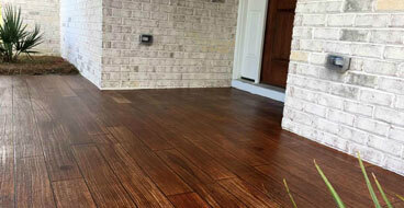 Longer Life Than Wood This image shows a floor that has a wood Stamped Concrete Flooring.