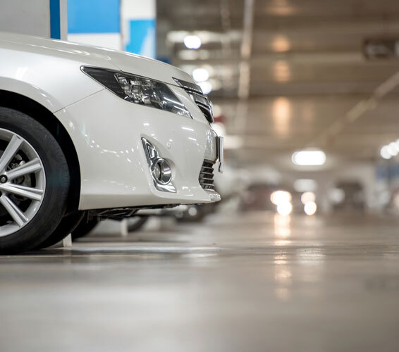 Garage Floor This image shows a white car parked.