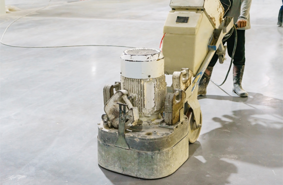 Industrial Epoxy This image shows a man polishing a floor.