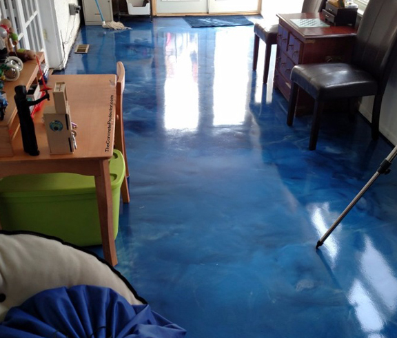 This image shows a commercial space with a blue epoxy floor.