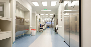 Commercial Epoxy Floor Coating This image shows a commercial space with a white and blue epoxy floor.