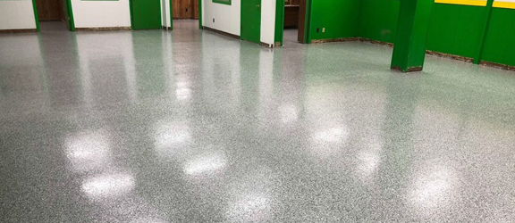 This image shows a Basement Floor with flake epoxy paint.