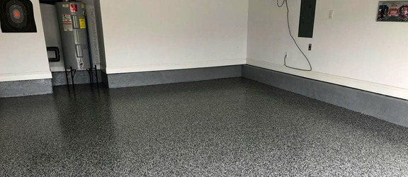Epoxy Floor Nampa This image shows a garage floor with flake epoxy painted floor.