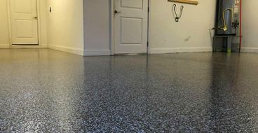 Epoxy Garage Floor This image shows a garage floor with flake epoxy painted floor.