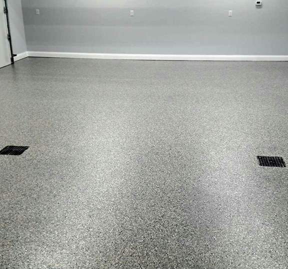 Flake Epoxy Garage This image shows a garage floor with flake epoxy painted floor.