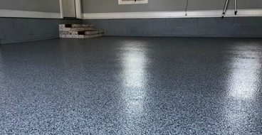 Garage Epoxy This image shows a garage floor with flake epoxy painted floor.