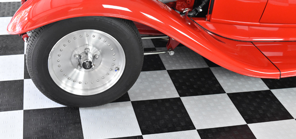 This image shows a red classic car.