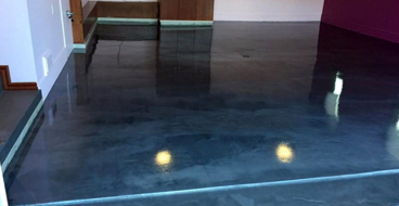 Garage Floor Epoxy This image shows a garage floor with metallic epoxy painted floor.