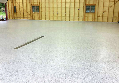 This image shows a commercial space with flake epoxy floor.