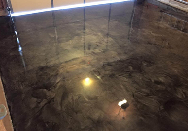 This image shows a garage with an epoxy floor.