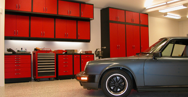 custom cabinets This image shows a garage floor with flake epoxy painted floor.