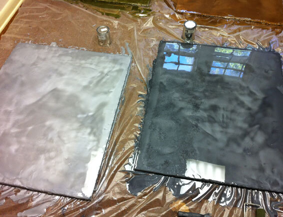 flooring-installation This image shows an epoxy paint sample that is color gray and black.
