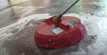 polished-concrete-contractors This image shows a man polishing a floor.