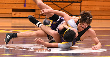 polished-concrete-floors This image shows 2 men wrestling.