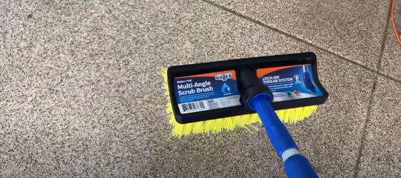 polished-concrete-garage-floor-6 This image shows a man scrubbing a floor.