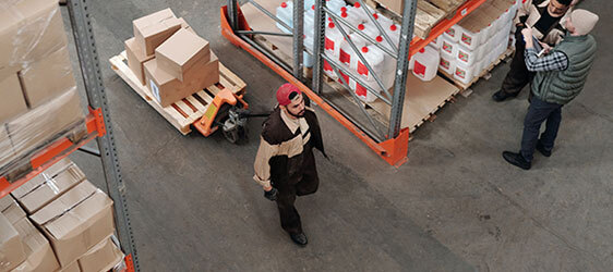 stained-polished-concrete This image shows men in a warehouse working.