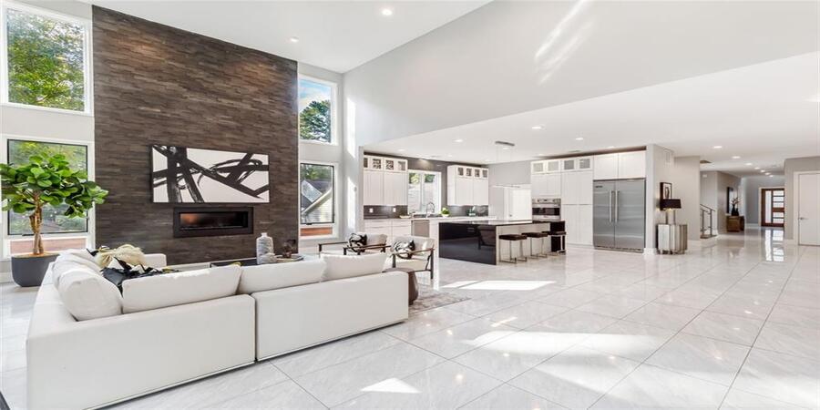 residential-epoxy_floor_coating This image shows a living room with a white epoxy floor.