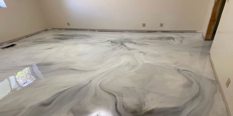 metallic-epoxy-floor This image shows a metallic epoxy floor. The color used was white and gray.